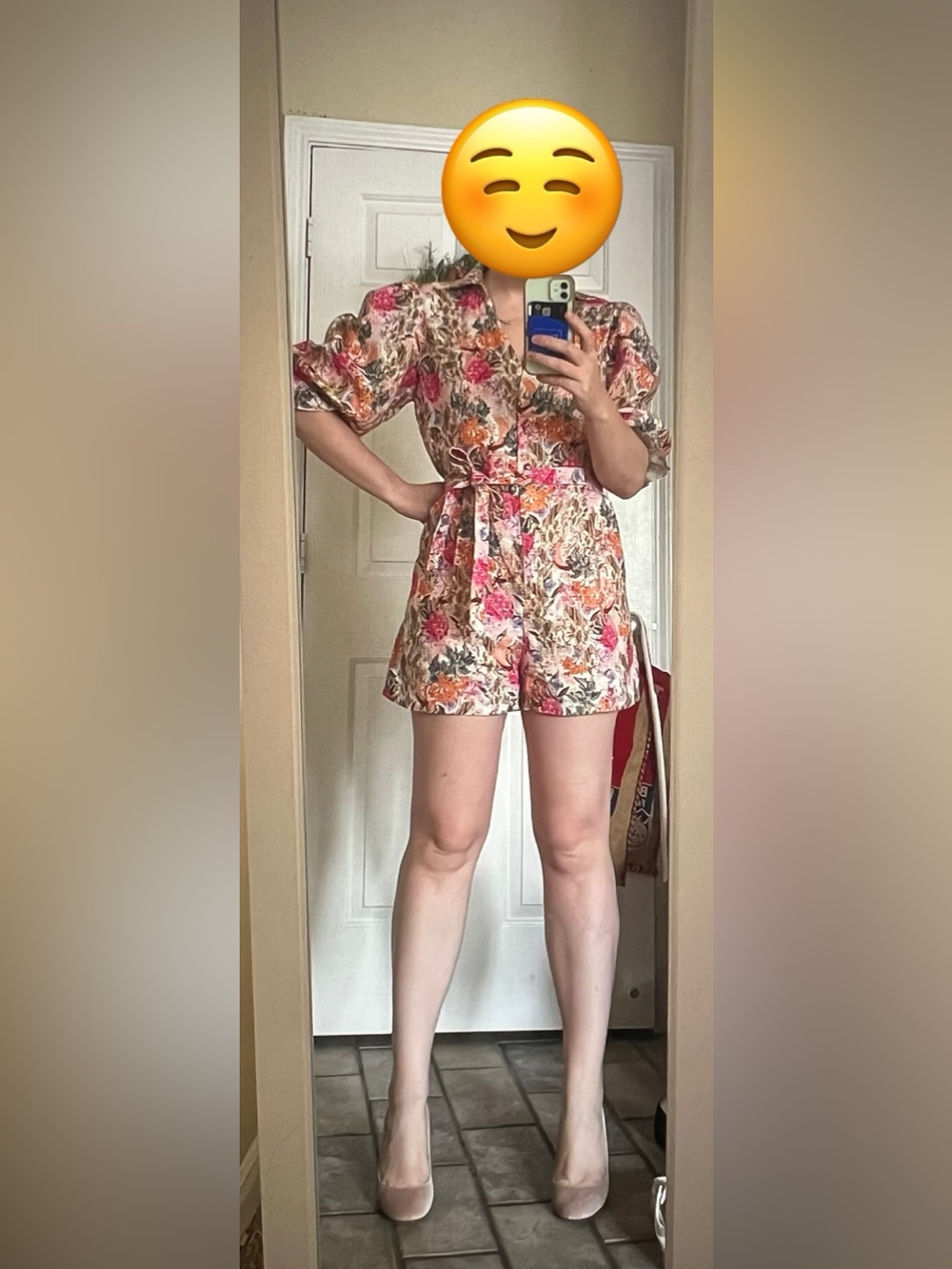 & Other Stories relaxed romper with tie waist and puff sleeves in floral linen.